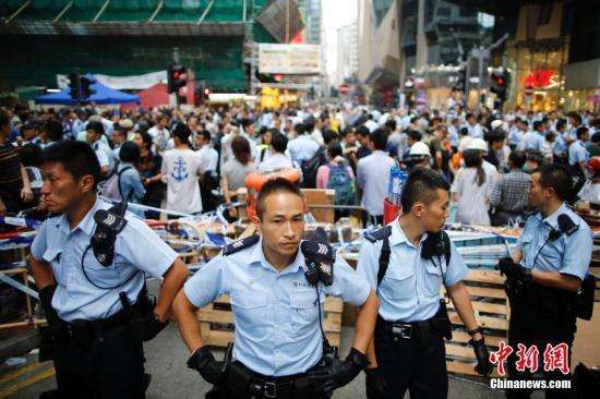 香港非法占中9人抵警署接受预约拘捕30日开审