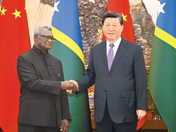 习近平会见所罗门群岛总理索加瓦雷