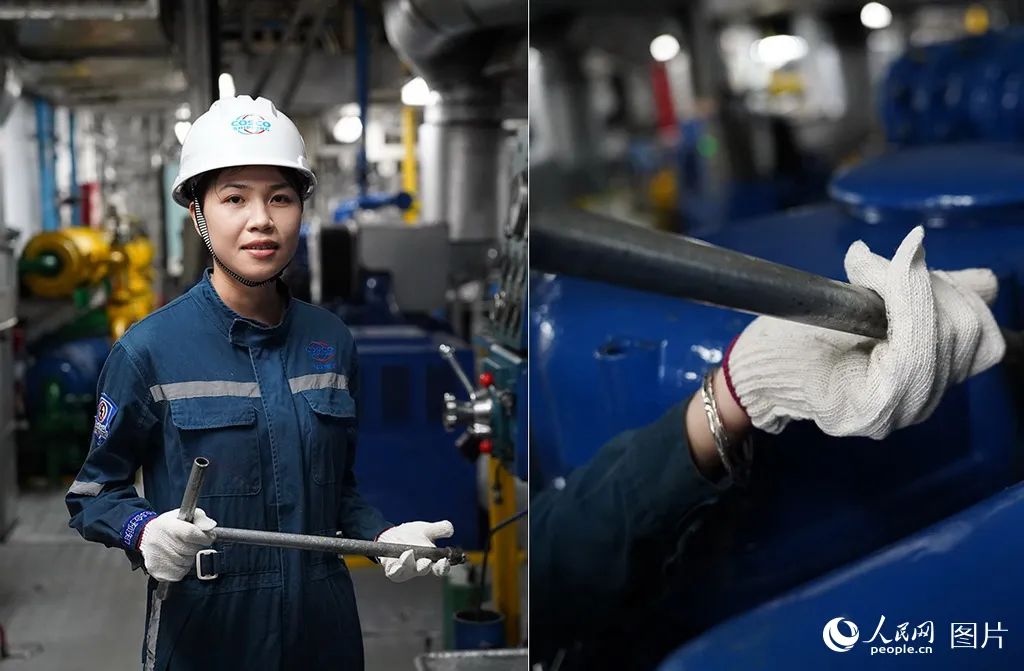 郑树霞正在用工具进行检修作业。 人民网记者 孟凡盛摄