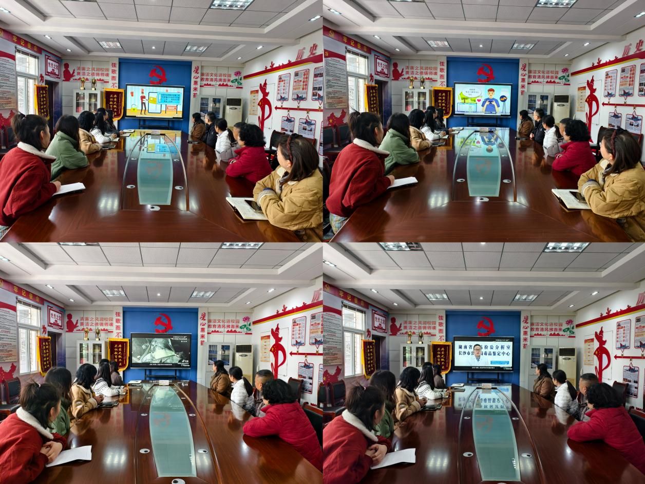 教师们在会议室集中收听观看直播