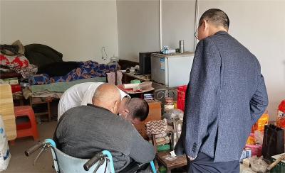 下乡入户送服务 真情助残暖民心