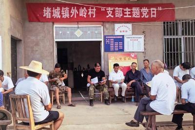 吴劲松身体力行：洪水袭来，他与儿子共守大堤七天七夜